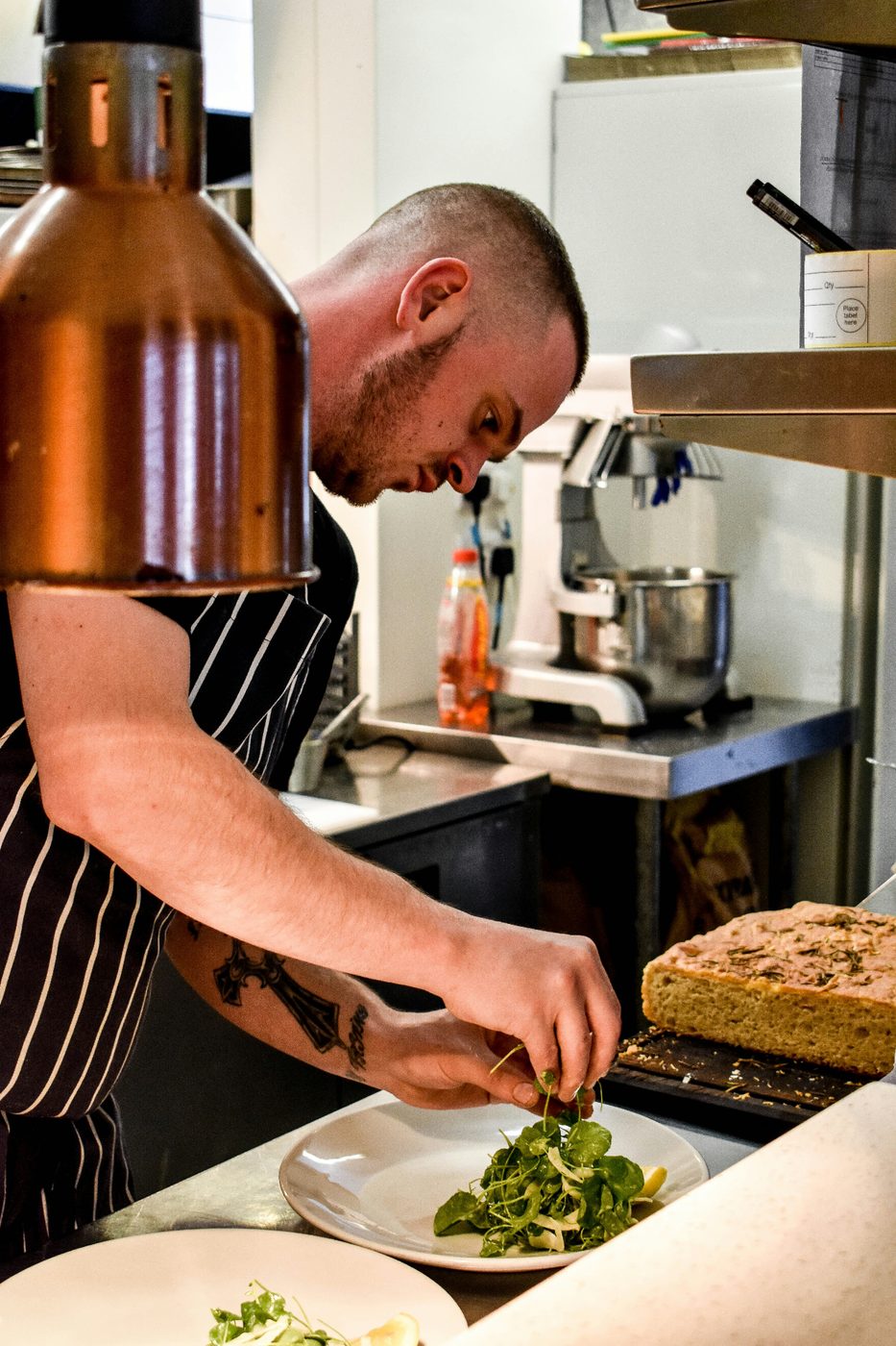 Chef plating a fresh dish for corporate catering Dublin service